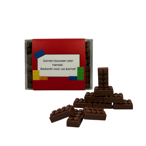 🧱 Samen bouwen aan herstel – chocoladesteentjes voor het IMG