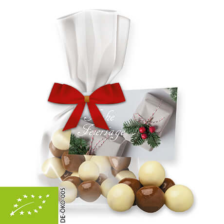 Bedrukte biologische Crunch Choco's, ca. 30g, in plat zakje met strik en bedrukt kaartje — promotioneel cadeau