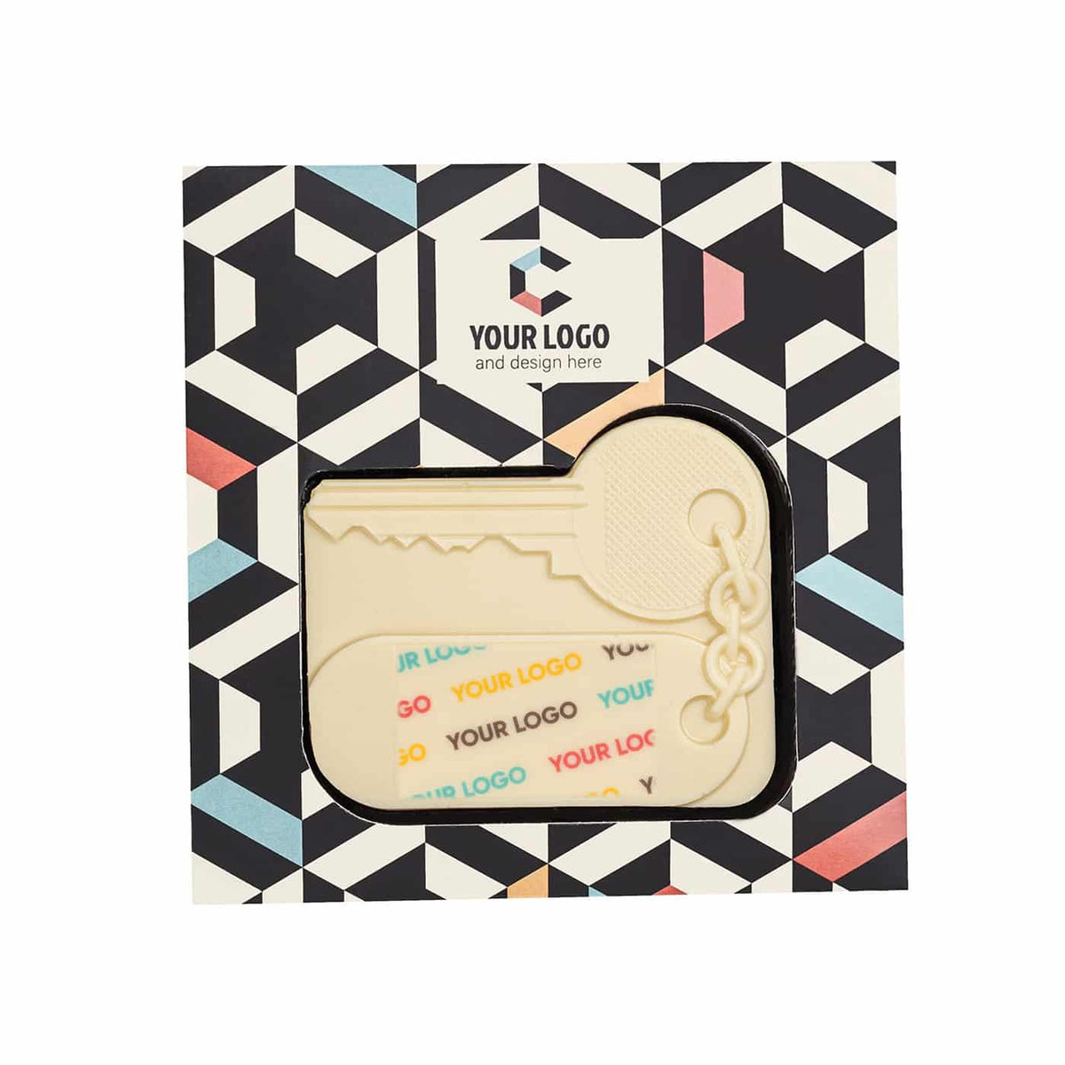 Huissleutel van witte chocolade met kleurrijke print in een doos met grafisch patroon