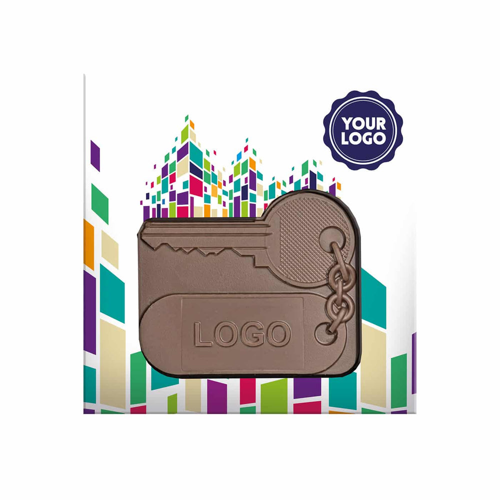 Chocolade huissleutel van melkchocolade in een doos met kleurrijk ontwerp en ruimte voor logo