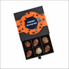 Halloween pralines met logo: zwarte doos met 9 bonbons en oranje banderol met eigen ontwerp
