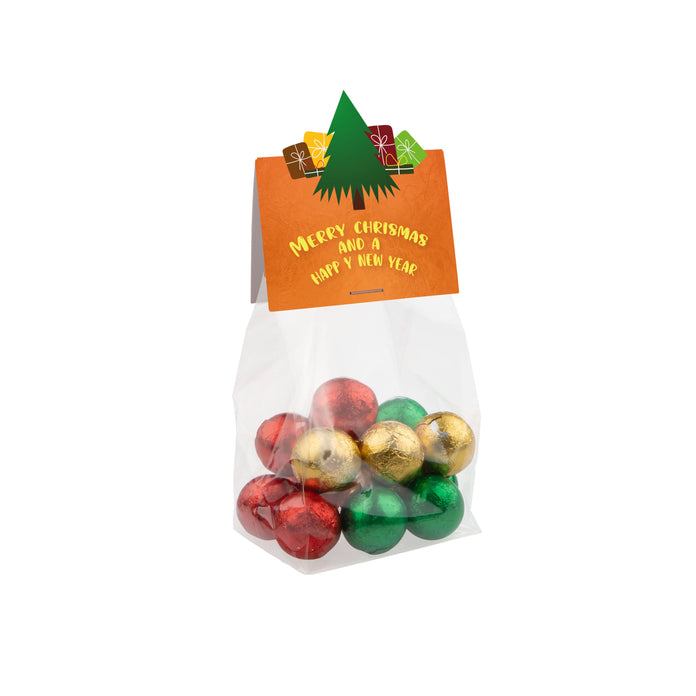 Transparant kerst blokzakje met melkchocolade kerstballen en kopkaartje in eigen vorm