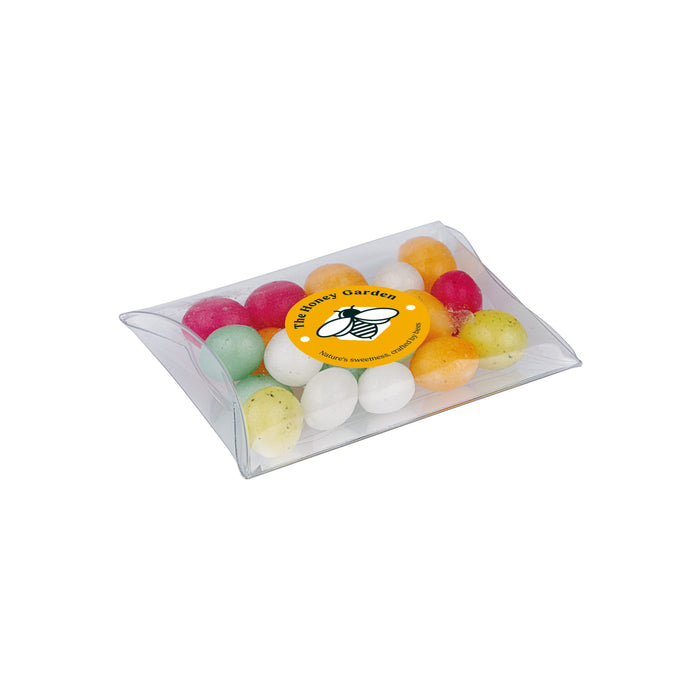 Transparant klikhulsje gevuld met gekleurde suikereitjes en een full colour sticker op de voorzijde