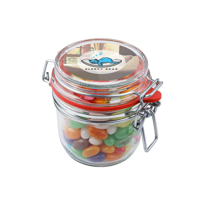 Glazen weckpotje van 0,25 liter gevuld met snoep en sticker met logo op het deksel: Jelly beans