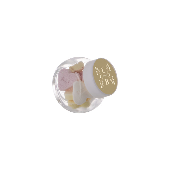 Micro glazen potje van 50 ml gevuld met snoep en ronde sticker met logo op het deksel: Vruchtenhartjes