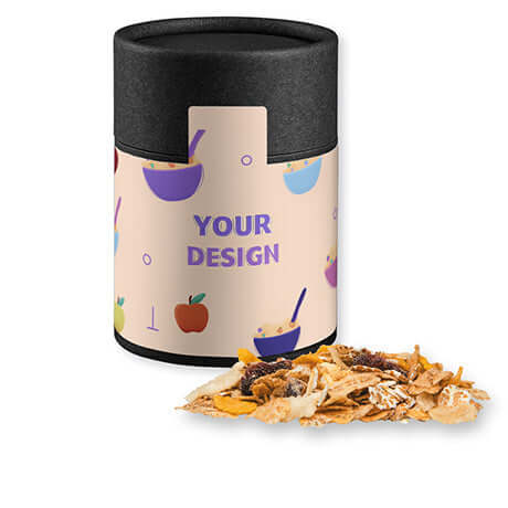 Bedrukte mueslireep appel cranberry ca. schwarz (ca. 60g) met persoonlijke sticker in zwart kokerblik met eigen design label