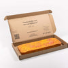Brievenbus Panettone Cake – brievenbusgeschenk in brievenbusdoos, frisse cake met sinaasappel en citroen, kokossnippers