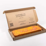 Brievenbus Panettone Cake – brievenbusgeschenk in brievenbusdoos, frisse cake met sinaasappel en citroen, kokossnippers