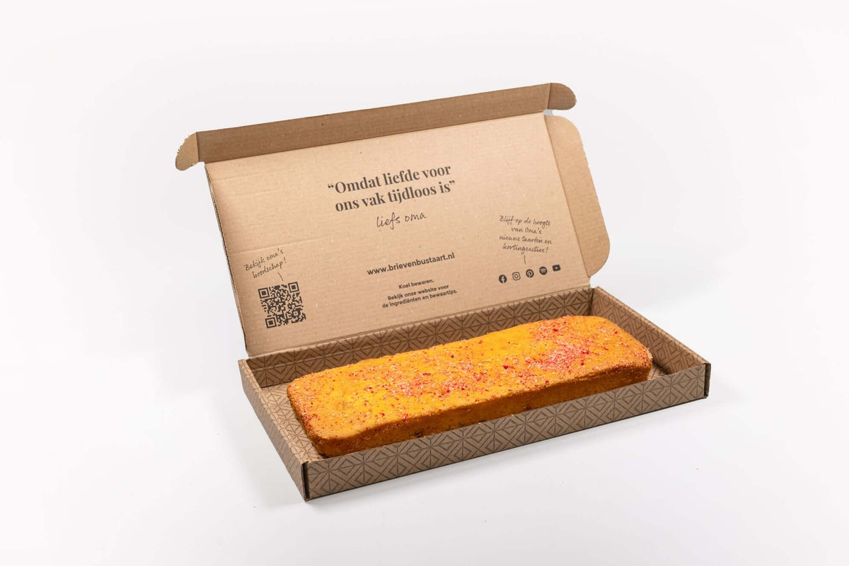 Brievenbus Panettone Cake – brievenbusgeschenk in brievenbusdoos, frisse cake met sinaasappel en citroen, kokossnippers