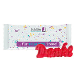 Flowpack van witte folie met Trolli fruitgom en een eigen ontwerp