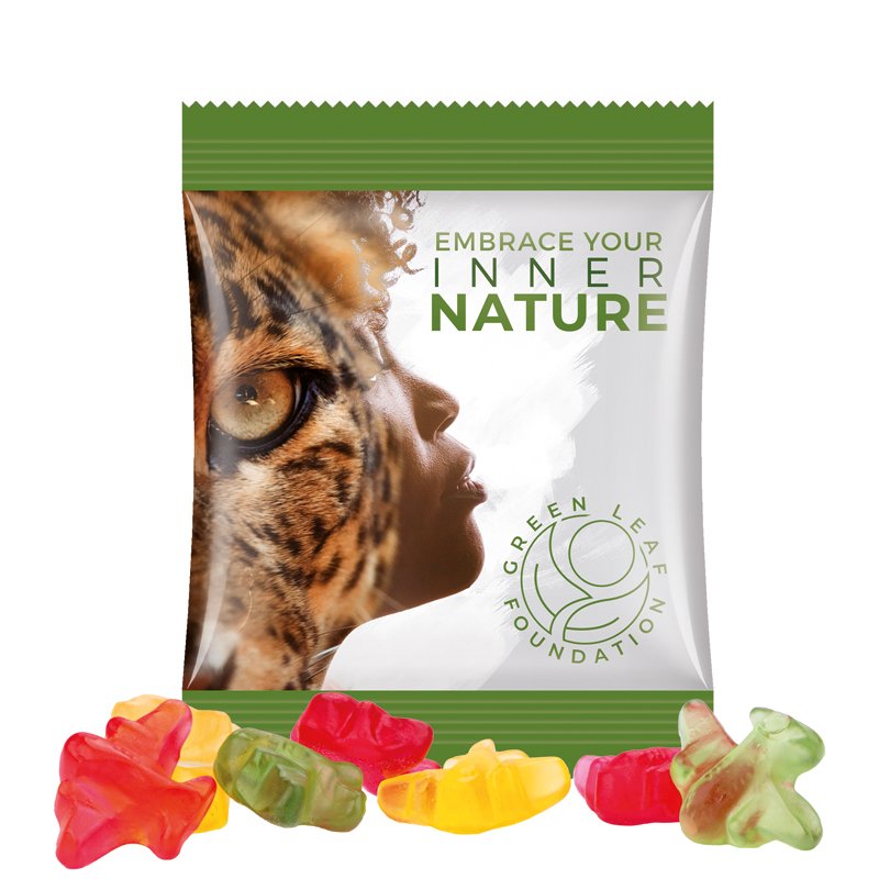 Zakje van witte folie met Trolli fruitgom in de vorm van een vliegtuigje