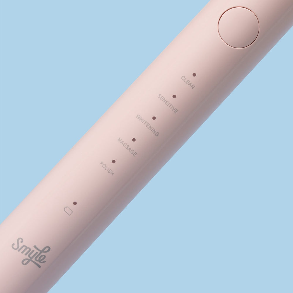 Close-up van de babyroze Smyle elektrische tandenborstel